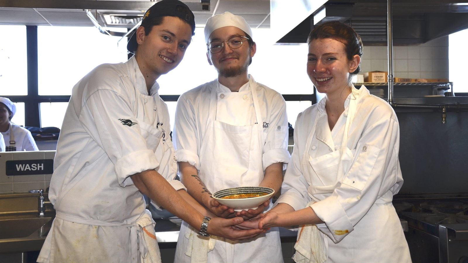 Culinary Arts students Gabe Thayer, Zach Kaczor and Naomi Bass finished making tomato soup.